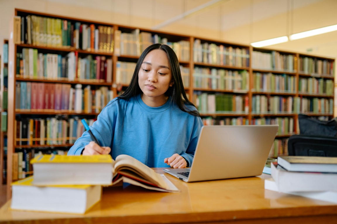 Student studying in library - Union Student Consultancy